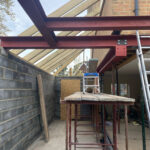 Structural steel work to support first floor and provide open ground floor space